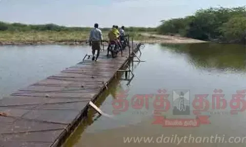 திருமங்கலம் மைக்குடி கண்மாயை மரப்பாலத்தில் பீதியுடன் கடக்கும் விவசாயிகள்- பாலம் கட்டி தர கோரிக்கை