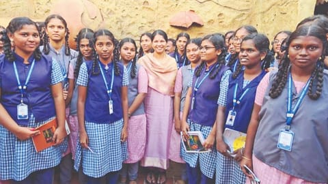 MP Kanimozhi flanked by students from government schools
at the Keezhadi museum in Sivaganga on Saturday