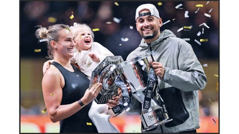 Aryna Sabalenka with her goddaughter Nicole and Nick Kyrgios celebrate with the titles
