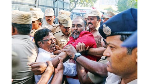 Police personnel on security evicting CPM cadre from the
protest venue near the US Consulate in Chennai on Monday