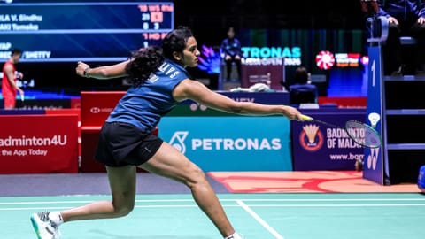 PV Sindhu returns a shot during her match