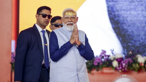 Prime Minister Narendra Modi addresses a gathering during the Shaurya Yatra procession as part of Somnath Swabhiman Parv, in Somnath, Gujarat