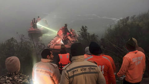 Police and State Disaster Response Force (SDRF) personnel conduct a search operation after a 27-year-old software engineer died