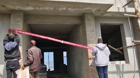 Officials seal an unauthorised building in Ooty