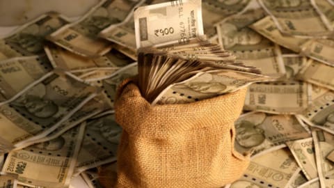 Image of a bag filled with cash used for representative image