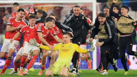 Benfica’s goalkeeper Anatoliy Trubin celebrates after scoring his team’s fourth goal against Real Madrid