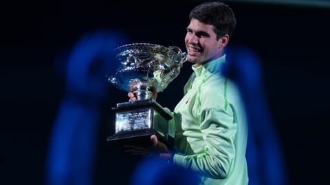 Carlos Alcaraz of Spain holds the Norman Brookes Challenge Cup after defeating Novak Djokovic of Serbia in the men's singles final at the Australian Open tennis championship in Melbourne, Australia, Sunday, Feb. 1, 2026