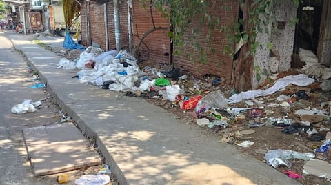 Garbage strewn over the footpath on Arcot Road in Kodambakkam