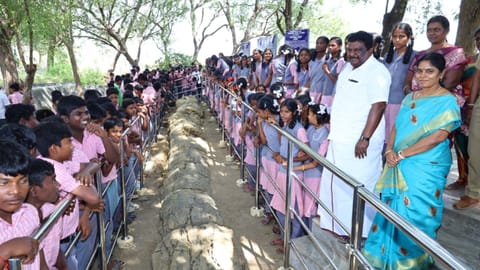 Transport Minister SS Sivasankar with school children at the fossil museum in Ariyalur on Saturday