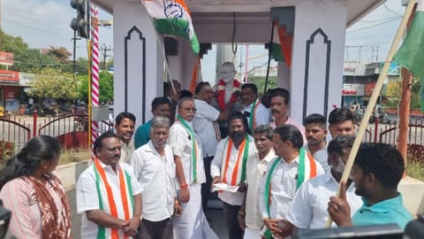 Members of the Congress party placing their petition in front of the Gandhi statue in Tiruchy on February 7