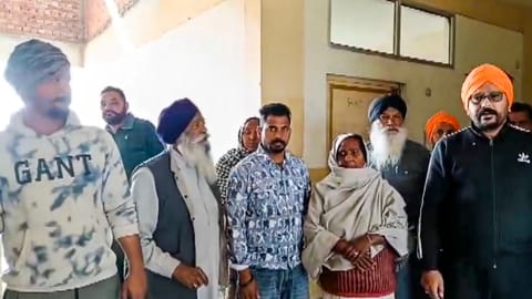 Family members of the victim gather at the institute after a female law student was shot dead by her classmate, in Tarn Taran district, Punjab, Monday, Feb. 9, 2026