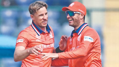 Netherlands' Logan van Beek (left) celebrates a wicket