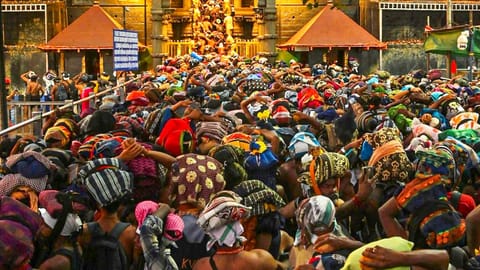 Rush of people as they wait to offer prayers at the Sabarimala temple ahead of the 'Makaravilakku' festival, in Pathanamthitta district, Kerala,