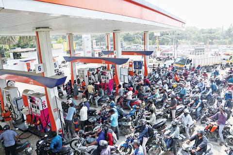 People throng a fuel station at Velachery on Thursday