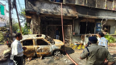 Madhya Pradesh Minister and BJP leader Kailash Vijayvargiya arrives to inspect the house that caught fire, in Indore, Madhya Pradesh, Wednesday, March 18, 2026