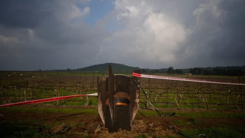 Fragment of a missile fired from Iran, and intercepted by Israeli defense system, sticks out in a open field in the Israeli-controlled Golan Heights