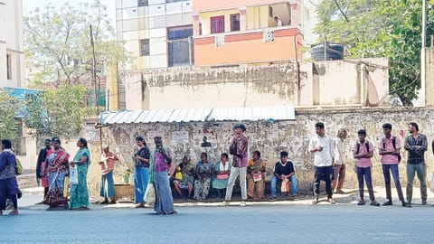 The makeshift bus shelter offers little cover for passengers