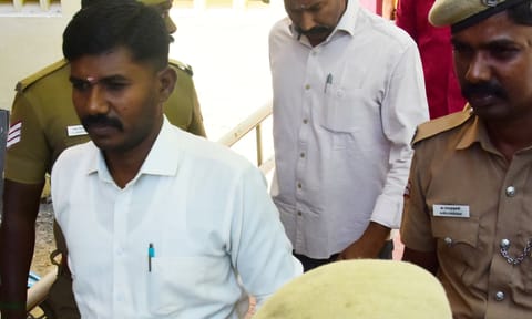 Convicts being brought to the Madurai district court under police escort on Thursday