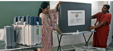 Women staff working at a polling station