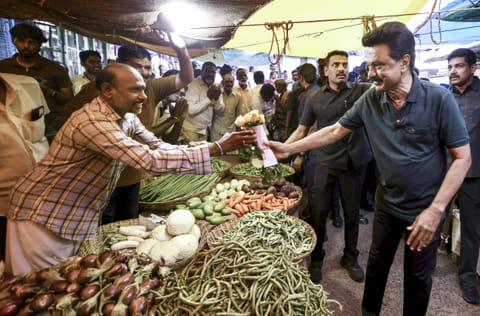 Tamil Nadu Chief Minister and DMK candidate from Kolathur constituency, MK Stalin, interacts with a vegetable vendor during a voter outreach ahead of the state Assembly elections, in Tiruvannamalai, Wednesday, April 8, 2026.