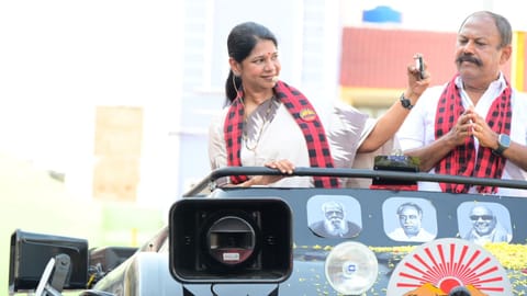DMK MP Kanimozhi taking a selfie during an election rally in Namakkal