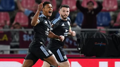 Aston Villa's Ollie Watkins, left, celebrates scoring during the Europa League soccer match between Bologna and Aston Villa in Bologna, Italy