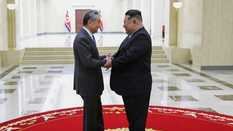 Leader Kim Jong Un, right, meets Chinese Foreign Minister Wang Yi in Pyongyang, North Korea