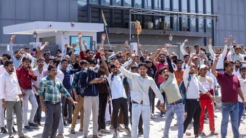 Factory workers during a protest demanding a hike in wages, in Noida, Gautam Buddh Nagar district, Uttar Pradesh, Monday, April 13, 2026