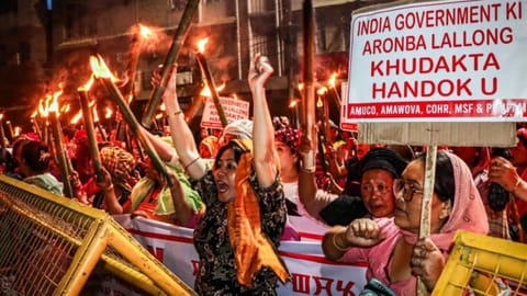 Protesters clash with police during torch rally