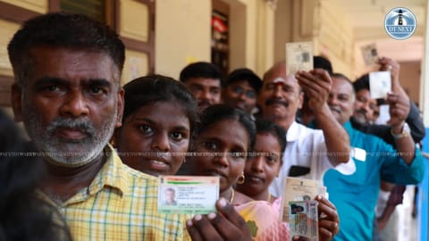 Voters waiting in a queue to cast their vote