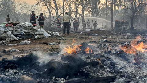 Firefighters containing fire at the manufacturing unit