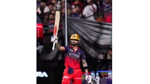 Royal Challengers Bengaluru's Virat Kohli greets fans as he returns to the pavilion after his dismissal by Gujarat Titans' Jason Holder during an Indian Premier League (IPL) 2026 T20 cricket match between Royal Challengers Bengaluru and Gujarat Titans, in Bengaluru, Karnataka, Friday, April 24, 2026