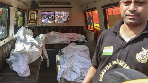Recovered bodies are being transferred in an ambulance after a fire in a four-storey residential building killed at least nine people, at Vivek Vihar area, in New Delhi