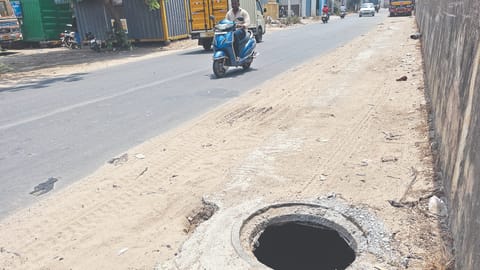 Uncovered manhole on pedestrian pathway posing a threat to public