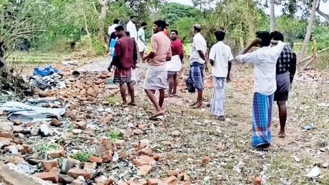 Raw materials and debris scattered near the collapsed unit at Kumbakonam on Saturday