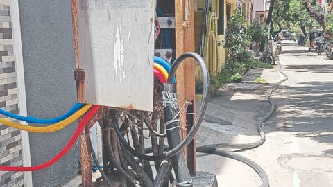 Temporary electric wires lying on MKB Nagar 11th Cross Street in Vyasarpadi