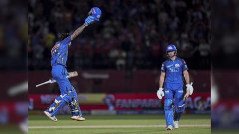 Mumbai Indians' Tilak Varma, front, celebrates after winning the Indian Premier League (IPL) 2026 T20 cricket match between Punjab Kings and Mumbai Indians, in Dharamshala.