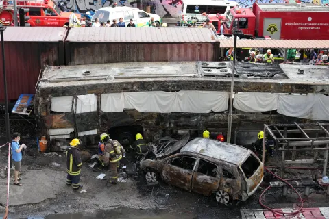 Rescuers work at a train crash site near an airport rail link station in Bangkok, Thailand, Saturday, May 16, 2026.