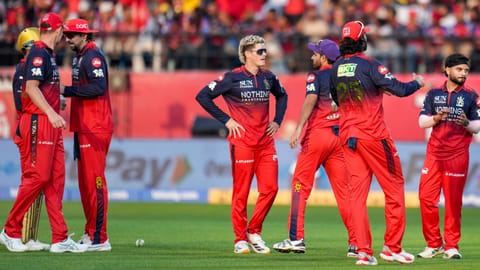 Royal Challengers Bengaluru's team celebrates after taking the wicket of Punjab Kings' Suryansh Shedge during the Indian Premier League (IPL) 2026 T20 cricket match between Punjab Kings and Royal Challengers Bengaluru, in Dharamshala, Himachal Pradesh, Sunday, May 17, 2026