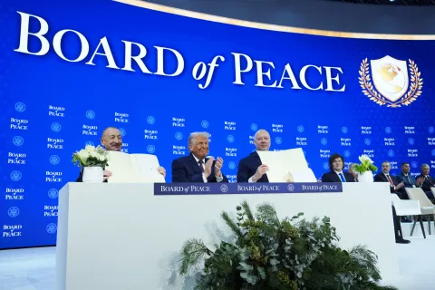 President Donald Trump, center, applauds as Ilham Aliyev, President of Azerbaijan, left, and Bulgaria’s Prime Minister Rossen Jeliazkov, right, hold up their signed Board of Peace charter during the Annual Meeting of the World Economic Forum in Davos, Switzerland