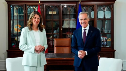 Prime Minister Mark Carney, right, meets with Premier of Alberta Danielle Smith at his office in Ottawa