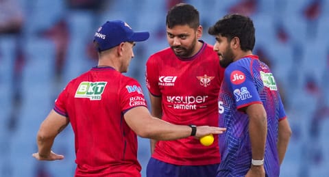 Lucknow Super Giants' head coach Justin Langer, left, interacts with Avesh Khan, centre, and Yash Thakur during warm-up before an Indian Premier League (IPL) 2026 T20 cricket match between Lucknow Super Giants and Punjab Kings, in Lucknow, Uttar Pradesh, Saturday, May 23, 2026