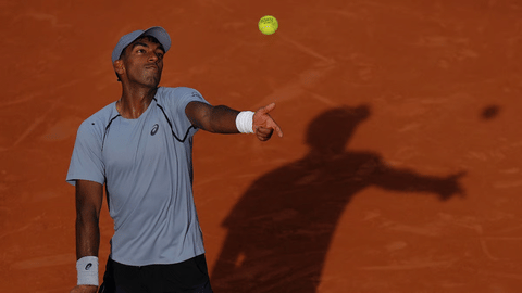 Nishesh Basavareddy of the U.S. serves to Taylor Fritz of the U.S. during their first round men's singles tennis match at the French Open tennis tournament in Paris, Sunday, May 24, 2026.