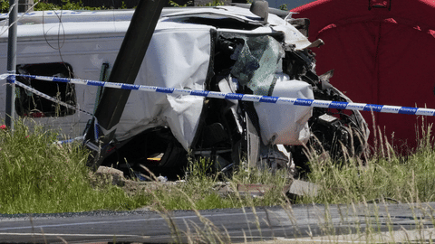 Police tape cordons off a level crossing where a train collided with a van in Buggenhout, Belgium, Tuesday, May 26, 2026.
