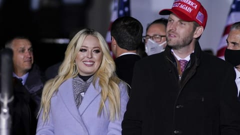 Tiffany Trump and Eric Trump listen as President Donald Trump speaks during a campaign rally at Kenosha Regional Airport