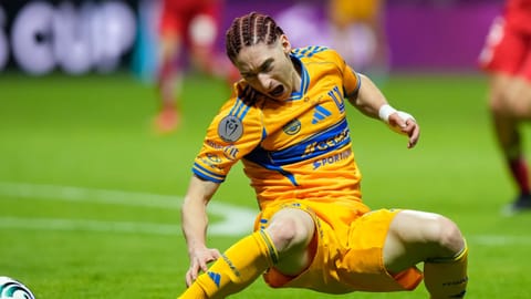 Tigres' Marcelo Flores gets injured trying to reach the ball during the CONCACAF Champions Cup final soccer match against Toluca in Toluca, Mexico