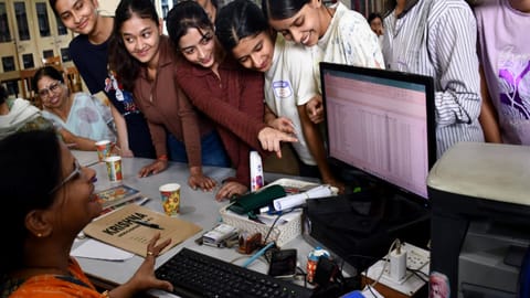 Students check their results after CBSE announcement
