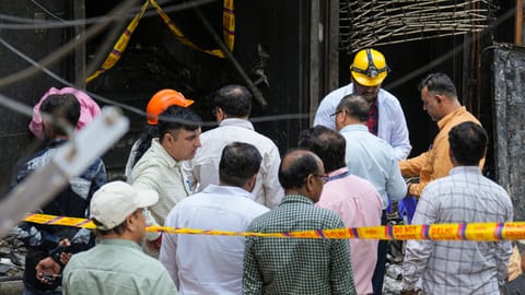 Forensic officials at the site after a fire broke out at a bed-and-breakfast in a five-storey building in south Delhi's Malviya Nagar area