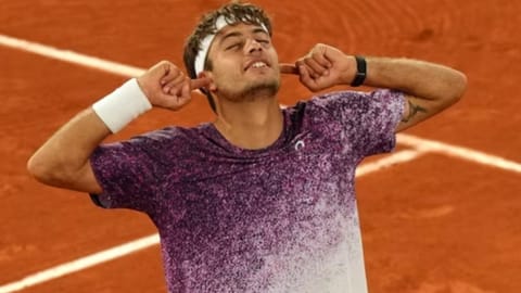 taly's Flavio Cobolli reacts after winning the quarterfinal tennis match against Canada's Felix Auger-Aliassime at the French Open in Paris