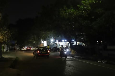 A main road in Anna Nagar without streetlights